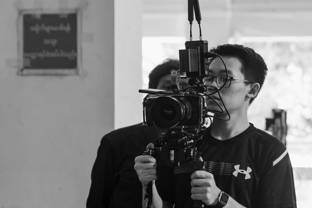 Presenter speaking in front of a professional television camera